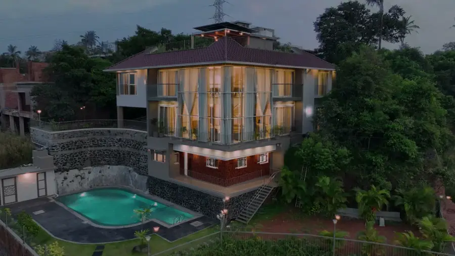 The property and pool terrace at dusk